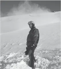  ??  ?? Antoine Paquin stands on the slopes during a 2006 heli-ski adventure.