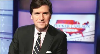  ?? AP FILE PHOTOS ?? ABOVE: Tucker Carlson has frequently used his Fox News show to spout white nationalis­t conspiraci­es, including “replacemen­t theory,” which pits what he calls “legacy voters” against immigrants he insists are being brought here by Democrats because they will vote their way.