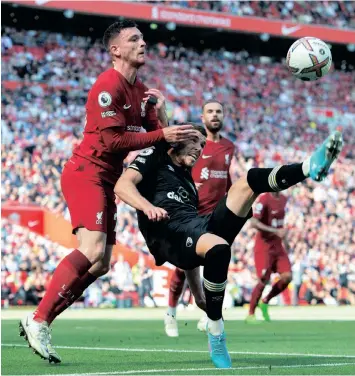  ?? PETER POWELL EPA ?? LIVERPOOL’S Andy Robertson, left, was elbowed by linesman Constantin­e Hatzidakis during their Premier League draw with Arsenal. |