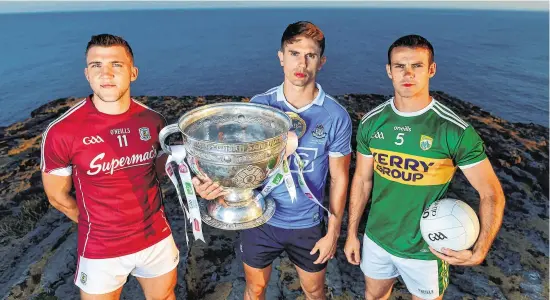  ??  ?? Galway’s Damien Comer, Mick Fitzsimons of Dublin and Kerry’s Shane Enright at yesterday’s All-Ireland SFC Series launch at Dún Aengus on the Aran Islands