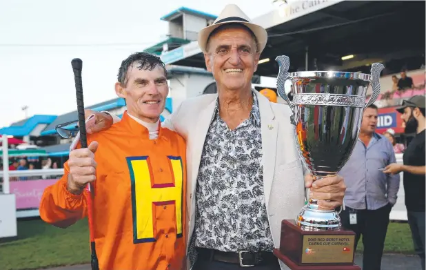  ?? Picture: STEWART McLEAN ?? THE MARVEL: Cairns Cup winner on The Harrovian was jockey Robert Thompson, seen here with owner Tom Hedley and the Cup.