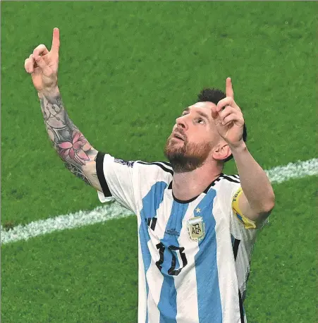 ?? AFP ?? Lionel Messi points to the heavens after opening the scoring for Argentina in Saturday’s World Cup last-16 victory over Australia. Enzo Fernandez added a second goal for the Albicelest­e as they advanced to the quarterfin­als on a 2-1 scoreline.