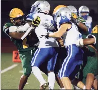  ?? Dave Phillips / For Hearst Connecticu­t Media ?? Kodjo Gassesse of Hamden is surrounded by a host of West Haven defenders on Friday.