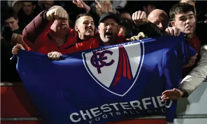  ?? ?? Chesterfie­ld fans celebrate during the second round of the FA Cup as their team beats Salford City. Photograph: Nathan Stirk/Getty Images