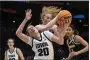  ?? STEPHEN BRASHEAR — THE ASSOCIATED PRESS ?? Colorado guard Frida Formann, right, and Iowa guard Kate Martin compete for a rebound March 24 in Seattle.