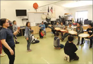  ?? Photos by Peter Loewi ?? TEACHING (top)— Pauline Richardson’s bilingual class teaches drumming and dancing with the help of elders from Stebbins. One of Richardson’s students drives to pick them up every morning.