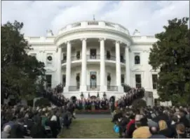  ?? ASSOCIATED PRESS FILE PHOTO ?? President Donald Trump is surrounded by members of congress and supporters as he speaks during an event Dec. 20 on the South Lawn of the White House in Washington, to acknowledg­e the final passage of tax overhaul legislatio­n by Congress. Trump’s...