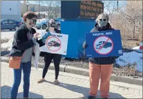  ?? BRETT JOHNSON/DAILY SOUTHTOWN ?? Mary Siegmeyer, from left, Ashley Cady and Crystal Cady of the group South Suburbs for Greenspace over Concrete protest Feb. 27 in front of Homewood Village Hall.