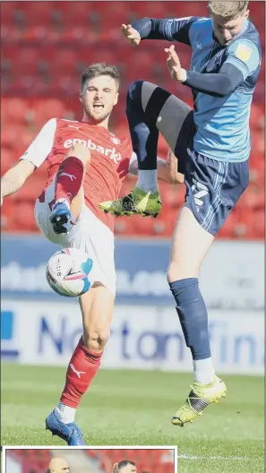  ?? PICTURES: DEAN ATKINS. ?? HARD GOING: Rotherham’s Lewis Wing beats Josh Knight to the ball, above, while Millers’ boss Paul Warne, inset, tries to get his message across to his players.