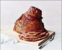  ?? MARKET CONTRIBUTE­D BY THE FRESH ?? The Fresh Market’s ham is double-glazed with honey and baked sugar, then smoked over hickory hardwood.