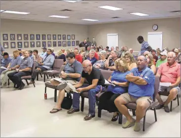  ??  ?? A full house of employees and citizens packed Polk County’s meeting on Aug. 2.