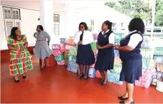  ?? ?? First Lady Dr Auxillia Mnangagwa thanks Immigratio­n Department officials for donating sanitary wear to her Angel of Hope Foundation at Zimbabwe House yesterday. Pictures: John Manzongo