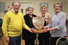  ??  ?? Michael O’Grady presents the Harry O’Grady trophy to Marian Cremin and Breda Donegan at Mallow Bridge/Golf Club recently.