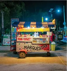  ??  ?? Laid-back hangout: Holbox is lined with white-sand beaches, top; local street food awaits on nights out, above; the island’s sunny streets, right, have few cars