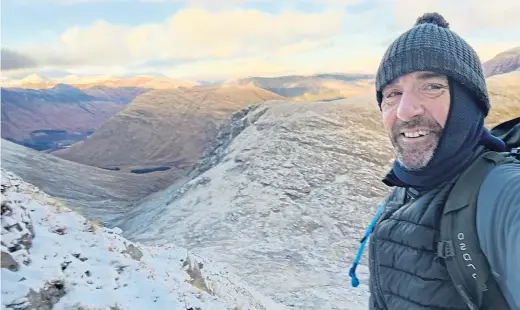  ?? ?? Jason Turnbull of Sight Scotland Veterans climbs Sgòr na h-Ulaidh in Glencoe to film more footage for the 3D tours