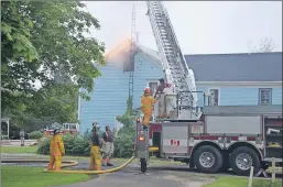  ?? LAWRENCE POWELL ?? Bridgetown firefighte­rs, with help from Lawrenceto­wn and Annapolis Royal, got this fire under control quickly late Wednesday afternoon and into the evening. Flames were coming out of the eaves when Chief Randy Sheridan arrived. Everyone got out safely.