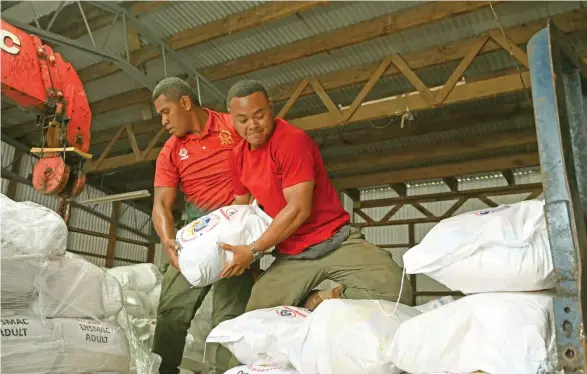  ?? Photo: National Disaster Management Office ?? Republic of Fiji Military Forces (RFMF) personnel offloading food rations in the storage facility in Vatunibale, Labasa on January 4, 2020.