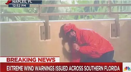  ??  ?? Wind barrier: In this screengrab, Sanders is seeking shelter behind a wall while reporting from Naples. — AP