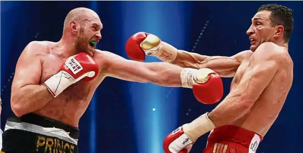  ?? — Reuters ?? He’s got the power: Tyson Fury landing a punch on Wladimir Klitschko in the world heavyweigh­t title fight in October 2015.