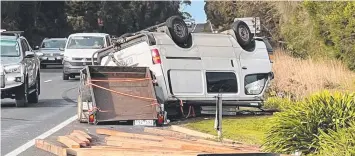  ?? ?? The overturned van on the Surf Coast Highway. Picture: Pete Bisak