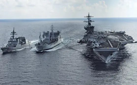  ?? Fuyuzuki ?? SEA HAWKS US aircraft carrier USS Theodore Roosevelt (R) and Japanese destroyer JS (extreme L) sail alongside Indian fleet tanker INS Shakti (R) during the Malabar exercise in 2015