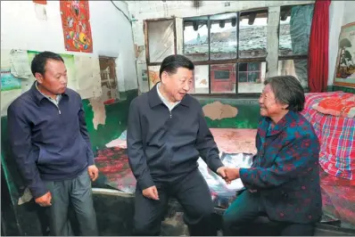  ?? PANG XINGLEI / XINHUA ?? President Xi Jinping visits a family in the mountainou­s village of Zhaojiawa, Kelan county, during his Shanxi inspection tour on Wednesday. He and the CPC are trying to lift families from poverty and to help them get rich.