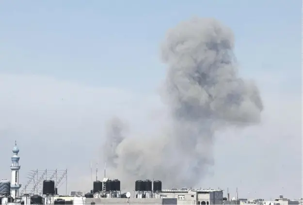  ?? ?? Smoke billows during Israeli strikes on Rafah yesterday, after Israeli prime minister Benjamin Netanyahu escalated his pledge to invade the southern Gaza city, refuge for around 1.4 million Palestinia­ns