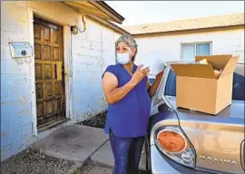  ?? David Becker For The Times ?? NORMA FLORES was earning enough waiting tables at a Henderson casino to live comfortabl­y. Now she’s one of many Nevadans waiting in food lines for hours.