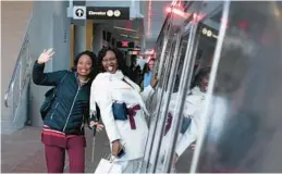  ?? JOSE LUIS MAGANA/AP ?? People ride on the new Washington Dulles Internatio­nal Airport metro during the opening of the new Silver Line extension at Washington Dulles Internatio­nal Airport on Nov. 15 in Chantilly, Virginia.