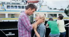  ?? RELATIVITY MEDIA ?? On the run from a bad marriage, Katie (Julianne Hough) meets mourning widower Alex (Josh Duhamel) in the contrived romance Safe Haven.