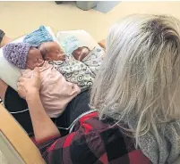  ?? HO/THE CANADIAN PRESS ?? A Saskatchew­an woman who performed CPR on one of her newborn triplets says all three babies are doing very well.