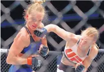  ?? NAM Y. HUH/ASSOCIATED PRESS ?? Valentina Shevchenko, right, punches Holly Holm during a women’s UFC bantamweig­ht MMA bout Saturday in Chicago.