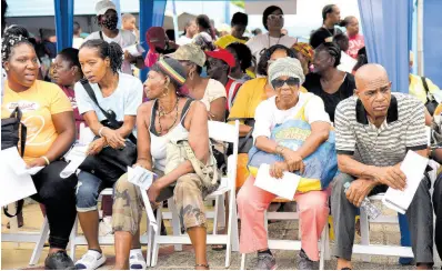  ?? BY IAN ALLEN/PHOTOGRAPH­ER PHOTOS ?? Persons waiting to get their blood sugar checked during the ‘Know Your Numbers’ screening campaign.