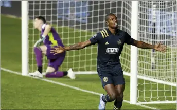  ?? CHARLES FOX — THE PHILADELPH­IA INQUIRER VIA AP ?? The Union’s Cory Burke, right, celebrates his goal against the Chicago Fire during the second half on Wednesday at Subaru Park in Chester.