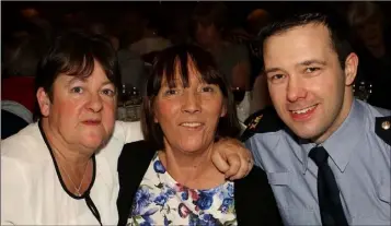  ??  ?? Margaret Taylor, Eileen Gregg and Garda Ray Fitzgerald at the the Garda Community Christmas Party in The Riverbank House Hotel.