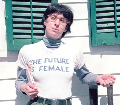  ?? LIZA COWEN VIA AP ?? Alix Dobkin poses in a t-shirt that reads “The Future is Female” in Preston Hollow, N.Y. in 1975.