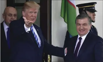  ?? AP PHOTO/SUSAN WALSH ?? President Donald Trump greets Uzbek President Shavkat Mirziyoyev outside the West Wing of the White House in Washington on Wednesday.