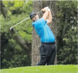  ?? TRIBUNE NEWS SERVICE ?? Patrick Reed hits from the first fairway during the third round of the Masters Tournament at Augusta National Golf Club on Saturday.