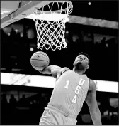  ?? NAM Y. HUH/AP ?? Team USA’s Zion Williamson goes up for a dunk against Team World during the Rising Stars game on Friday night.