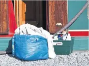  ?? ?? Bags of laundry alongside are a sure sign that a cleaning team is at work inside a boat.