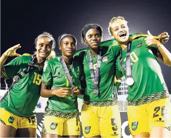  ?? FILE ?? From left: Reggae Girlz Jadyn Matthews, Deneisha Blackwood, Konya Plummer (captain), and Giselle Washington.