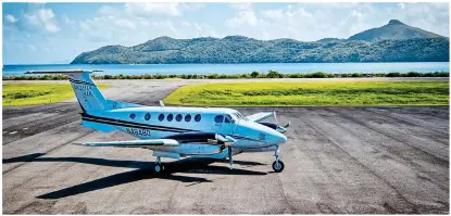  ??  ?? blue heaven: The bay that greets guests at the Bequia Beach Hotel and, above, the nineseater ‘Bequia Air’ plane acquired by its owner. Right: One of the hotel’s rooms