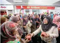  ?? SHAHRILL BASRI/ THESUN ?? Rohani officiates at the national level Mothers' Day celebratio­n at Alamanda shopping centre in Putrajaya yesterday.