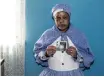  ??  ?? ROSY Tshabalala holding a picture of her late mother Julia Kedibone Tshawe.