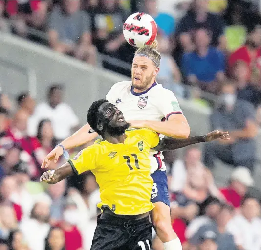  ?? ?? United States’ Walker Zimmerman leaps above Jamaica’s Shamar Nicholson (front) to head the ball during a FIFA World Cup qualifying match in Austin, Texas on Thursday, October 7.