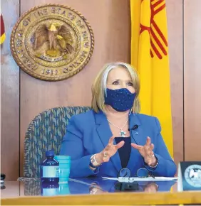  ?? SANTA FE NEW MEXICAN ?? Gov. Michelle Lujan Grisham detailed a revised public health order that runs now through May 31 during a Friday news conference at the Capitol.