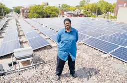  ?? JIM MONE/AP ?? Bishop Richard Howell Jr. stands among hundreds of panels on the roof of Shiloh Temple Internatio­nal Ministries, also a “community solar” provider, in Minneapoli­s.