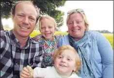  ??  ?? Helen Tomlinson with husband Steve and their children May and Hughie.