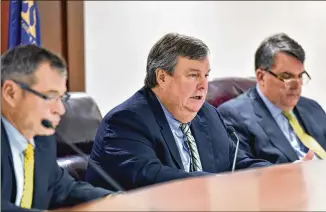  ?? HYOSUB SHIN / HSHIN@AJC.COM ?? Commission chair Stan Wise (center) speaks during a Georgia Public Service Commission meeting last year. The five-member body’s roles and decisions affect the daily lives of Georgia residents. Commission­ers are elected statewide but serve the people...