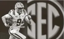  ?? Mike Stewart / Associated Press ?? A&M SEC West rival LSU saw a record-tying 14 players selected in the NFL draft, including No. 1 pick Joe Burrow.